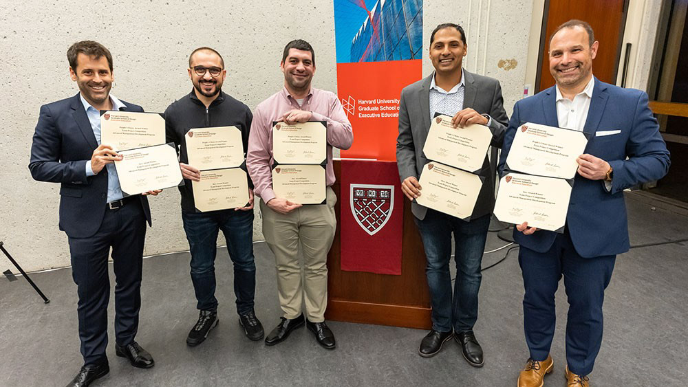 Group of participants holding certificates of completion