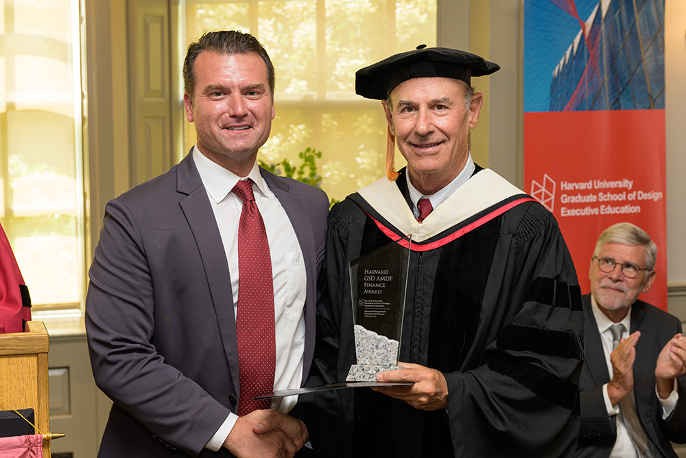 Steve Hutto being presented with a graduation award