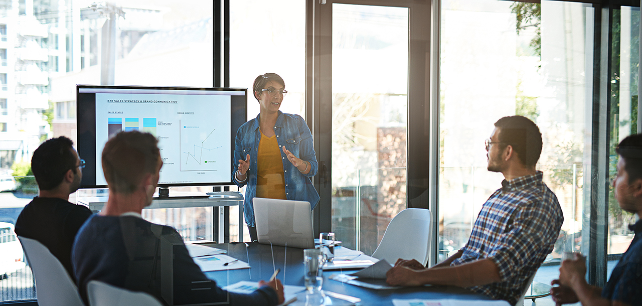 a confident presentation being given in a well-lit room