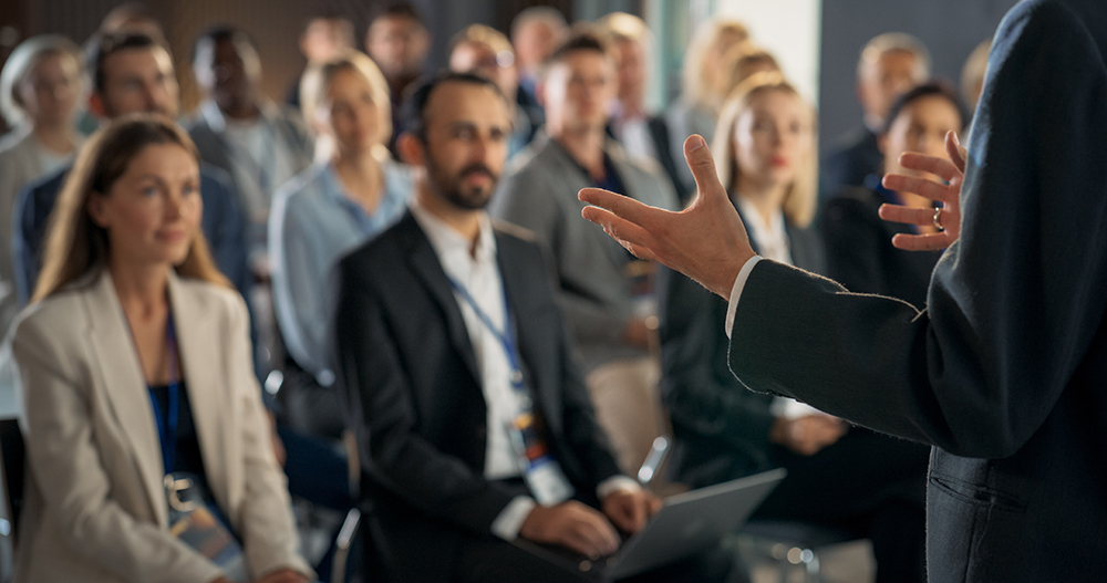 a leader confidently presenting to an audience