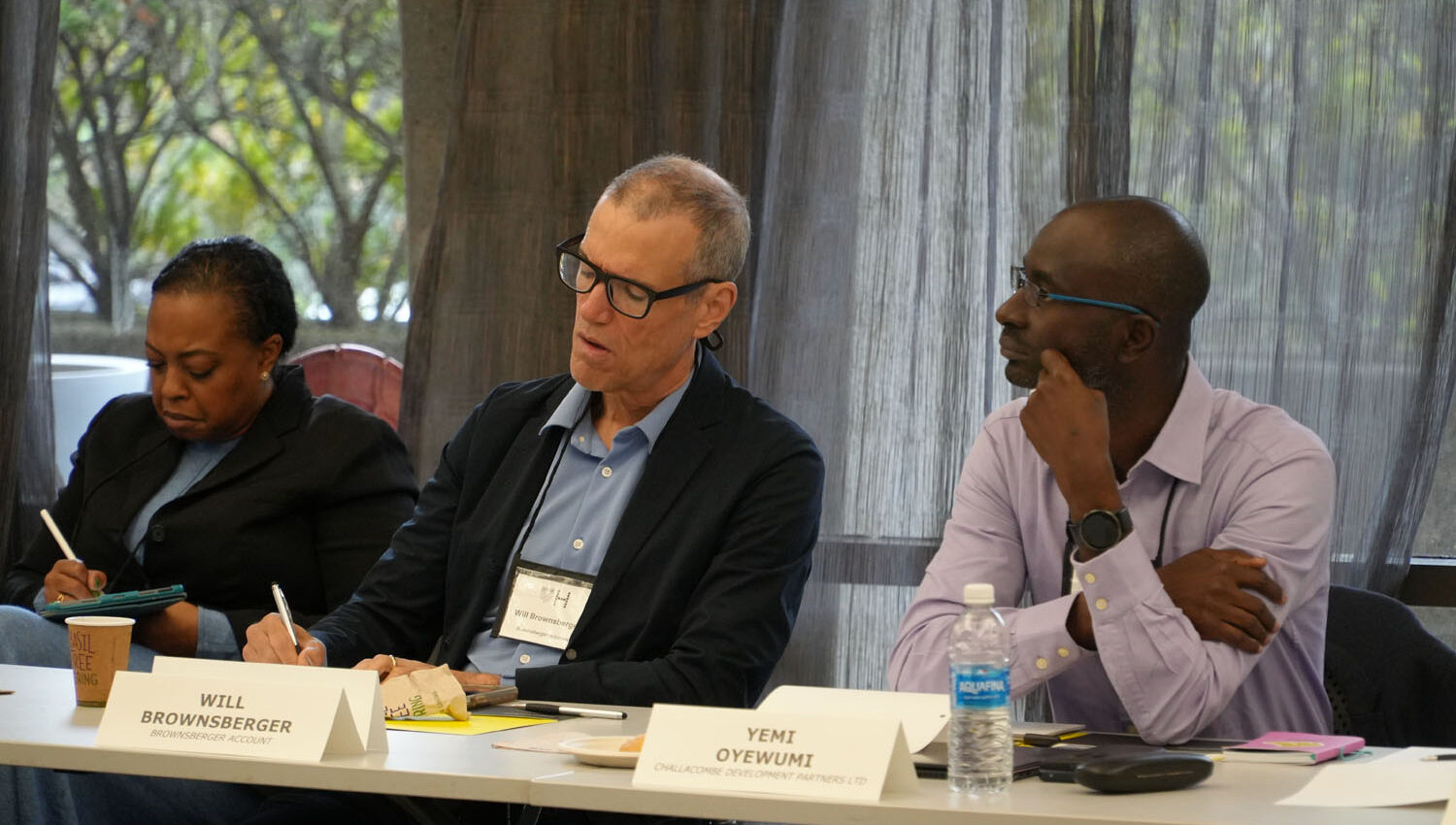 participants patiently listening and taking notes in a session