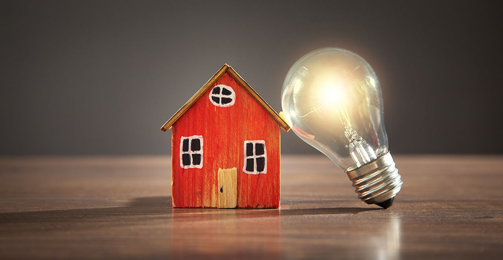 a house with a lightbulb next to it