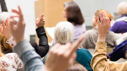 raised hands at an event