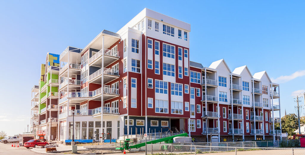 a modern apartment building nearing completion